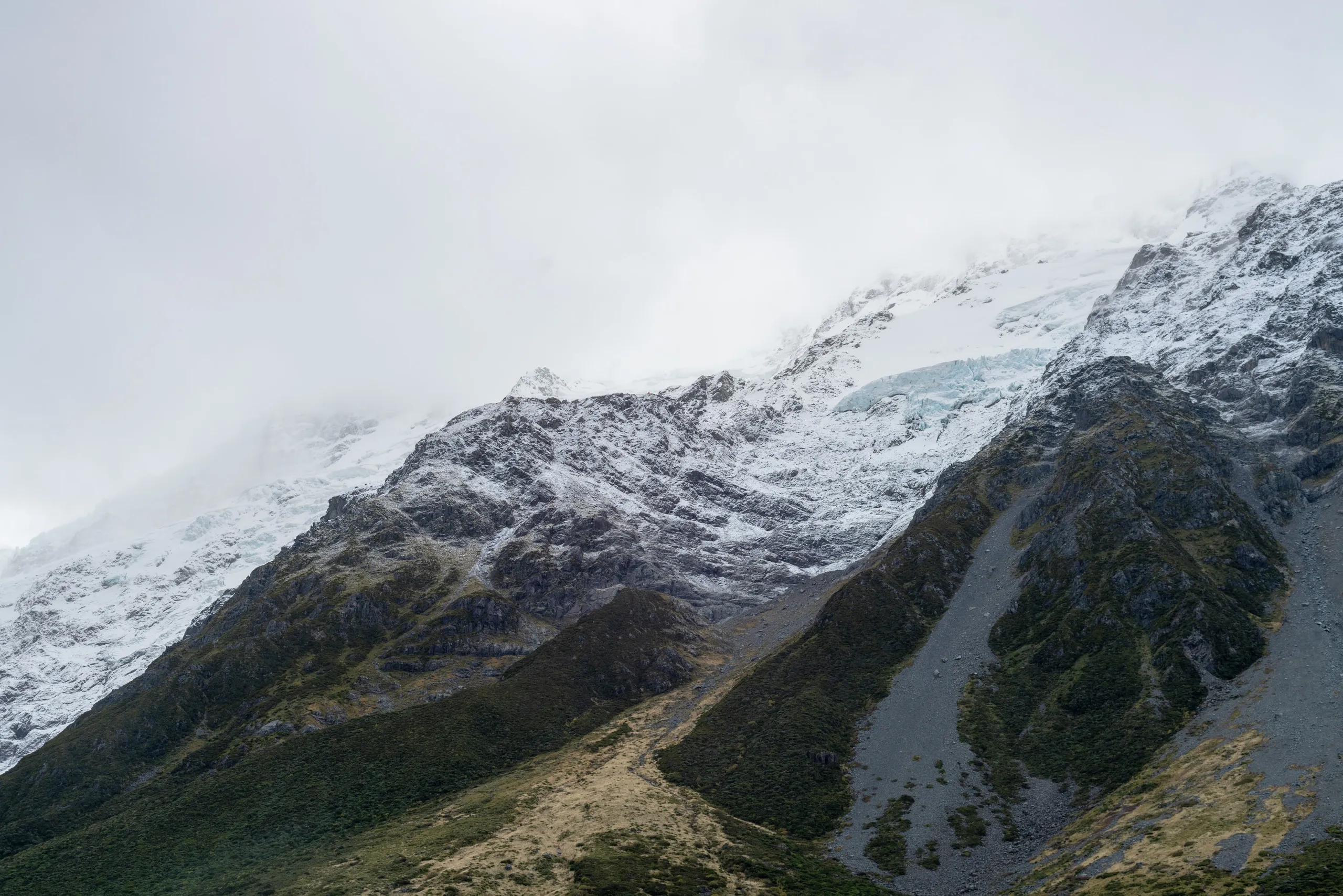 Looking up to Mt Sefton. An ominous shelf of ice is present and so too is Sefton Bivouac, merely a few red pixels in this image (click for higher resolution).