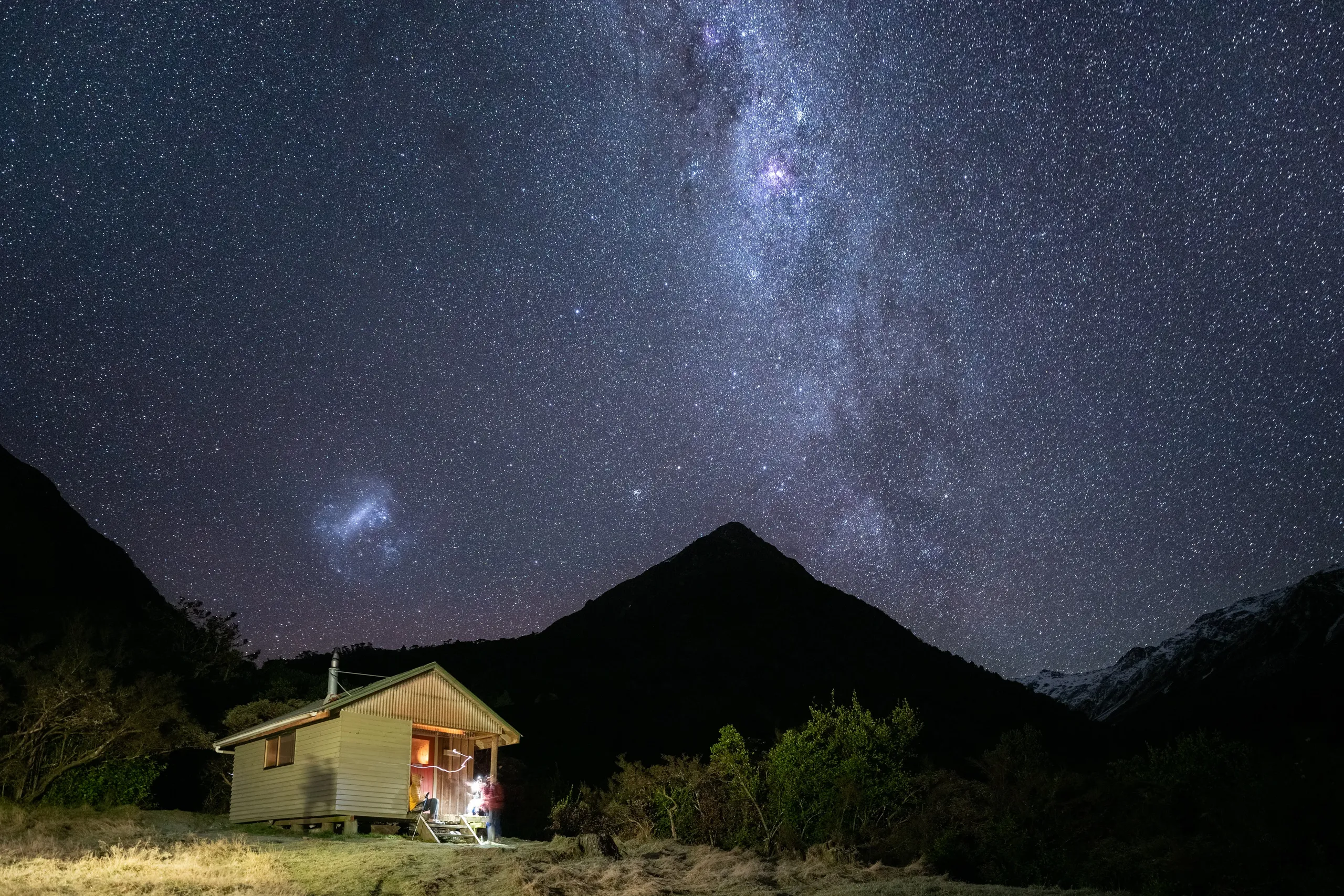 Stargazing on the balcony at Julia Hut. Grevilles Cone (centre) and Campbell Range (right) can be seen in the background - not to mention the Large Magellanic Cloud.