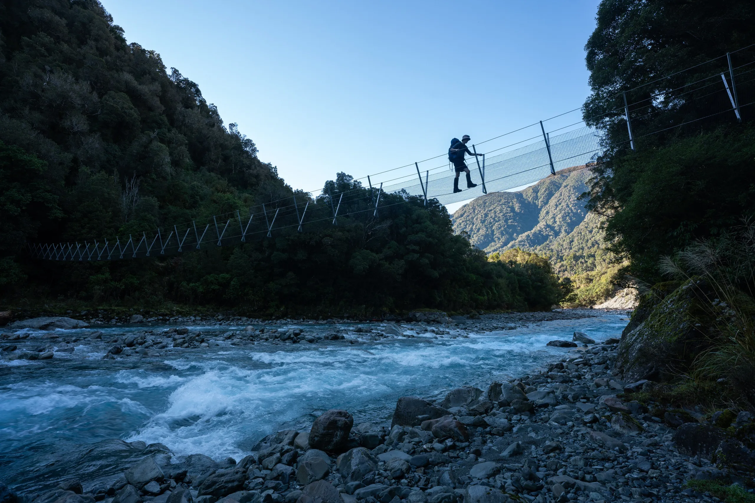 Crossing the lengthy three-wire bridge between Mid Taipo and Dillon Huts