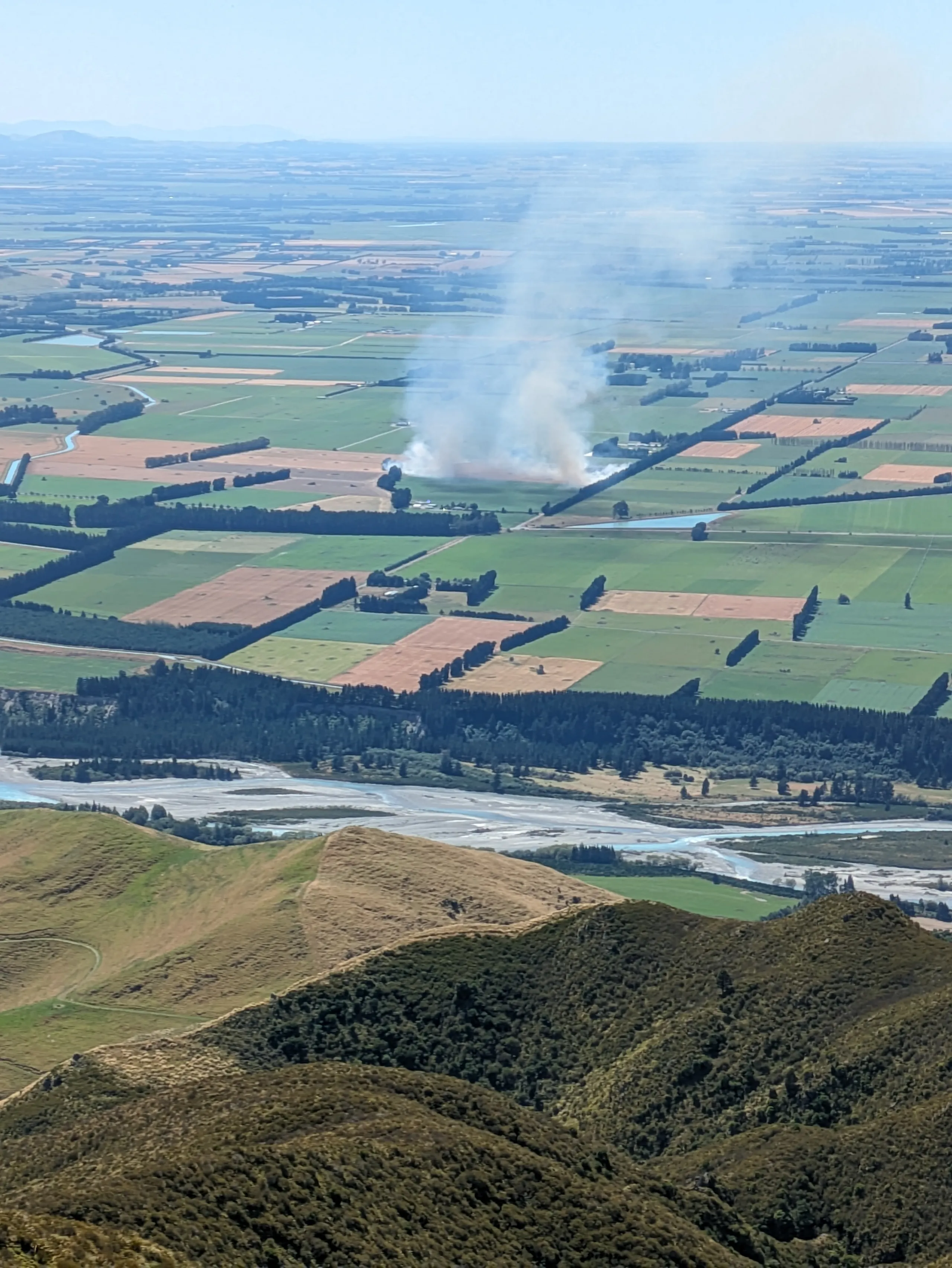 Nearby grass fire which developed (and was extinguished) while we were above the bushline
